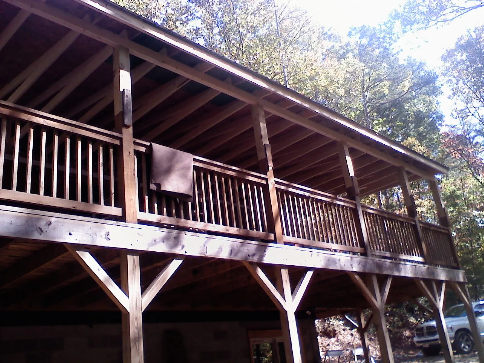 Timber framing under a new elevated porch and deck — Roof Leak Repair in Cedar Rapids by Roofing Brothers